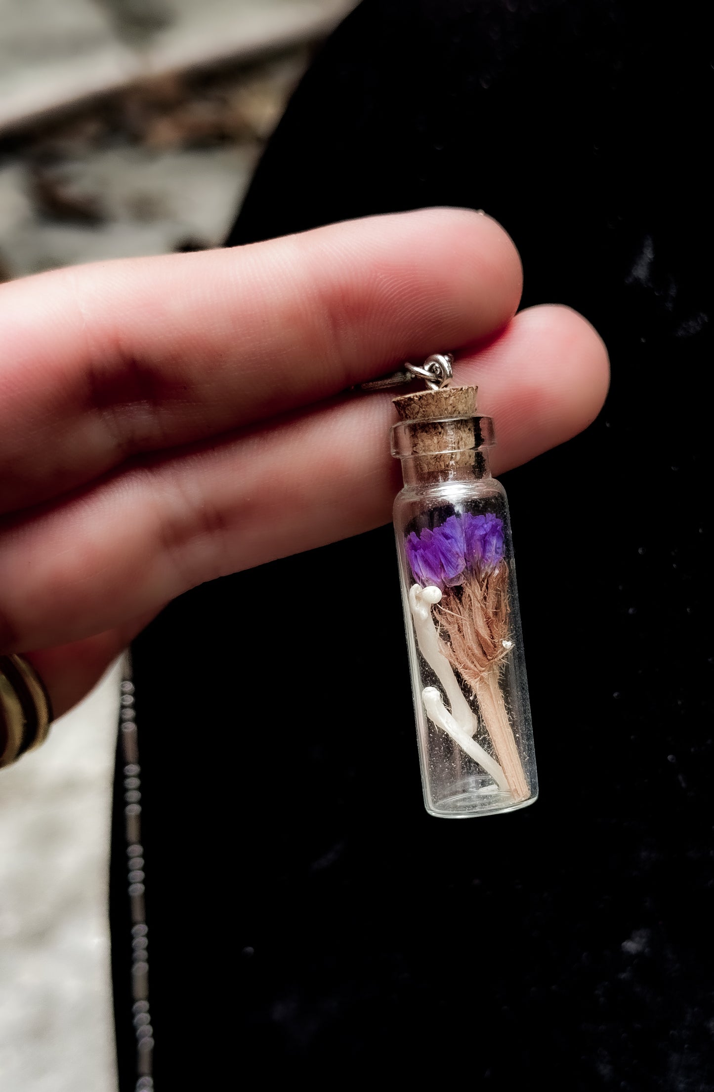 Bottle of bones necklace